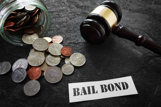 Coins and legal gavel with paper Bail Bond message